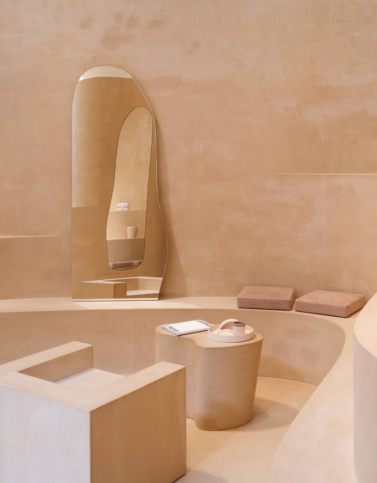 Tadelakt plaster bathroom in warm terracotta