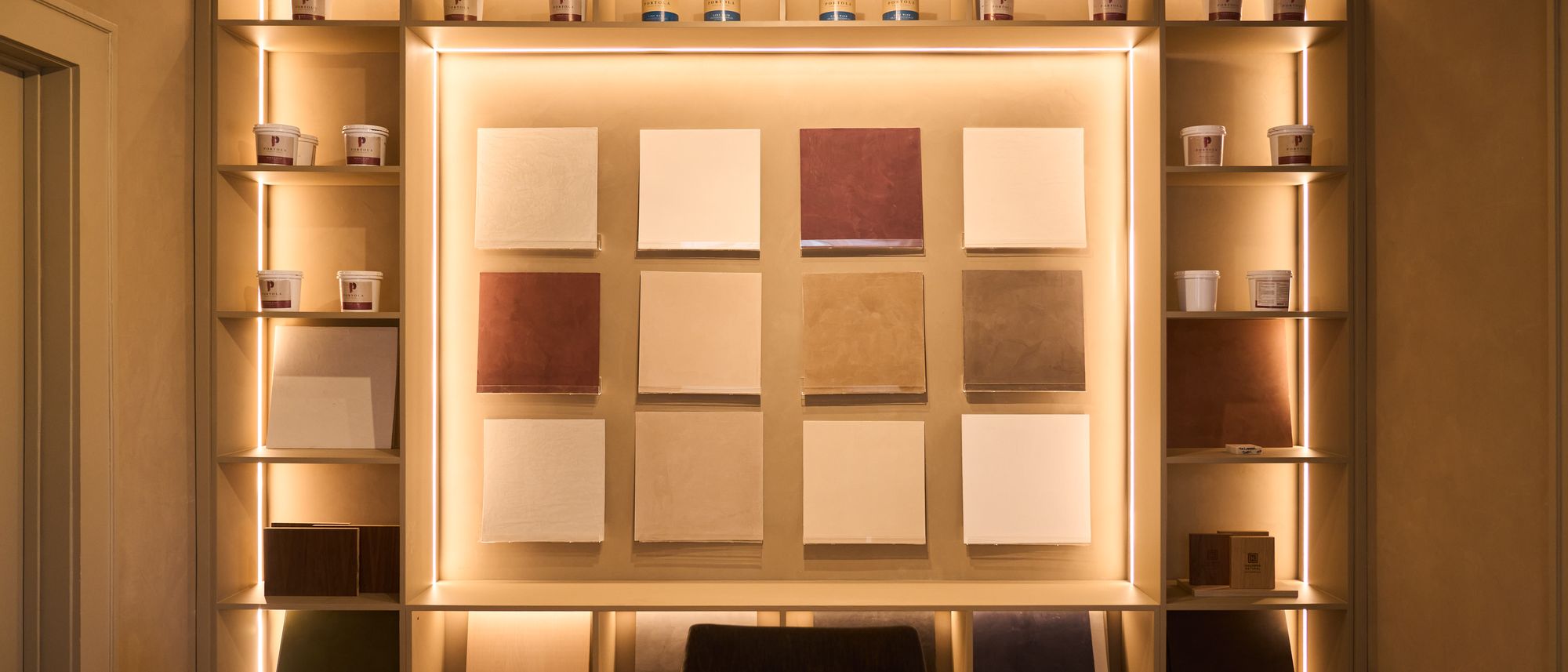 The Koncept Plaster showroom at 2404 Lake Austin Blvd in Austin, Texas, with finished sample walls on display.