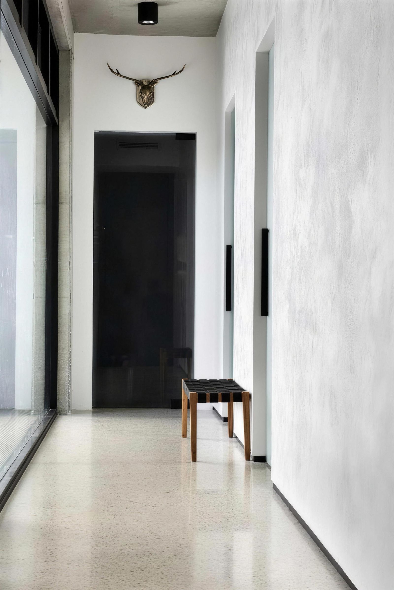 Venetian plaster hallway wall with a soft, mottled sheen