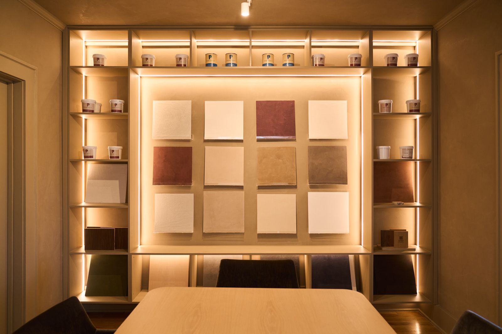 Wall of plaster color and texture samples in the Koncept Plaster showroom, Austin, Texas