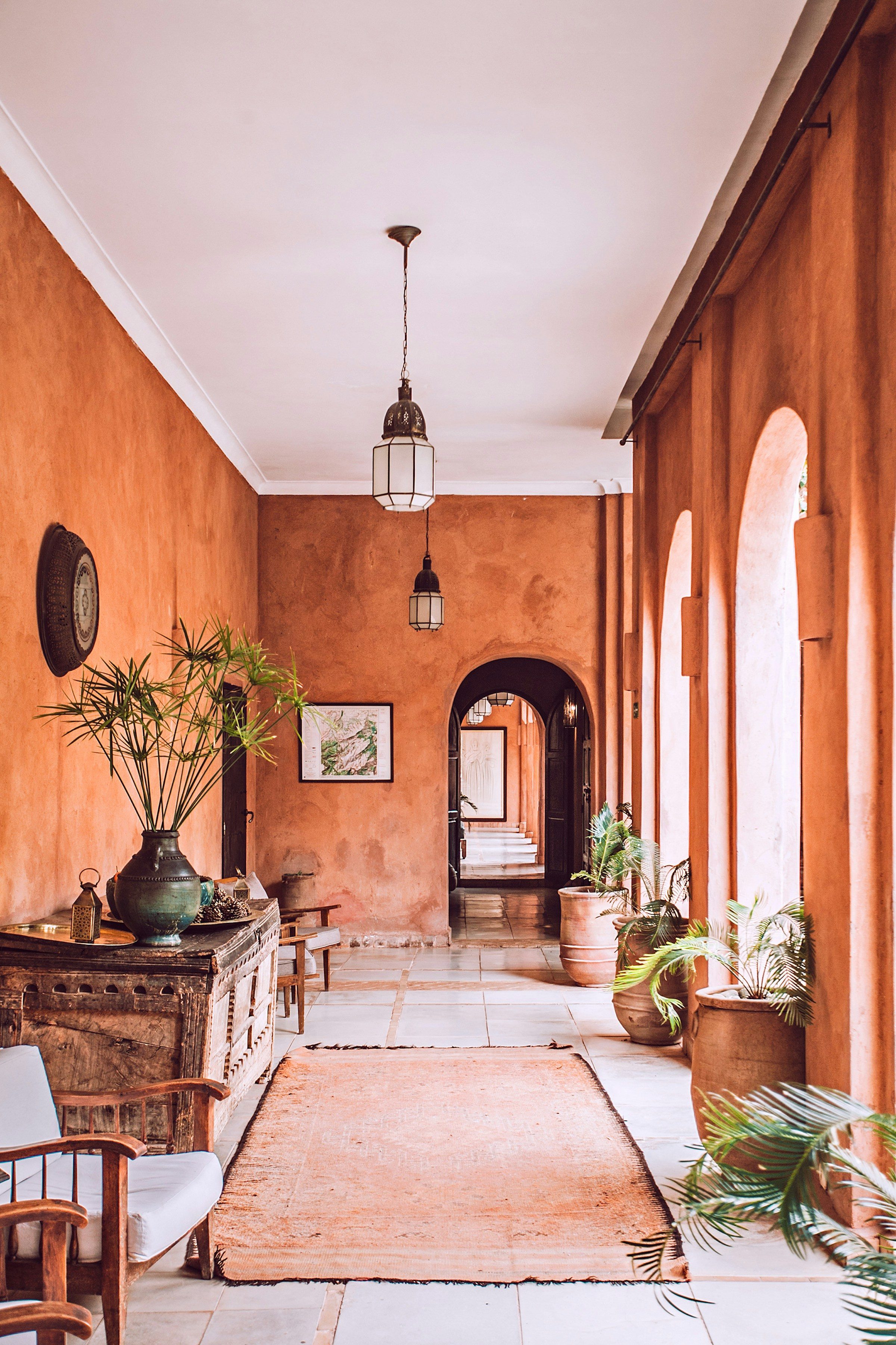Terracotta plaster corridor with arched openings