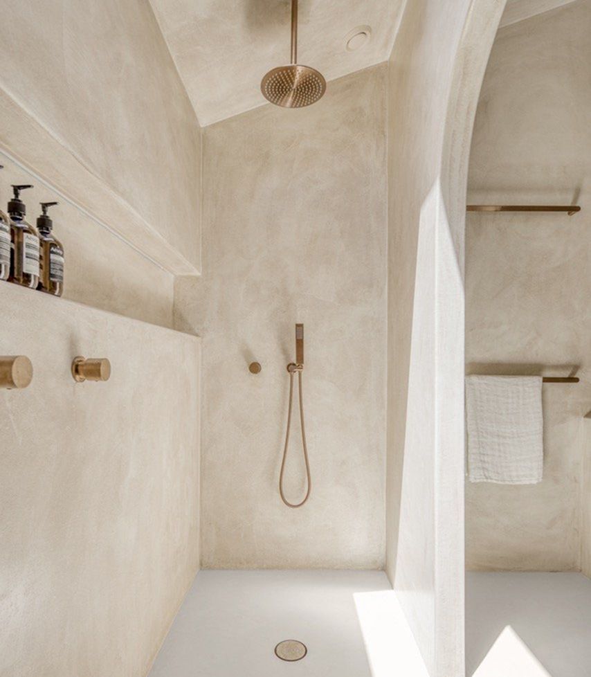 Venetian plaster wall paired with natural wood and stone finishes