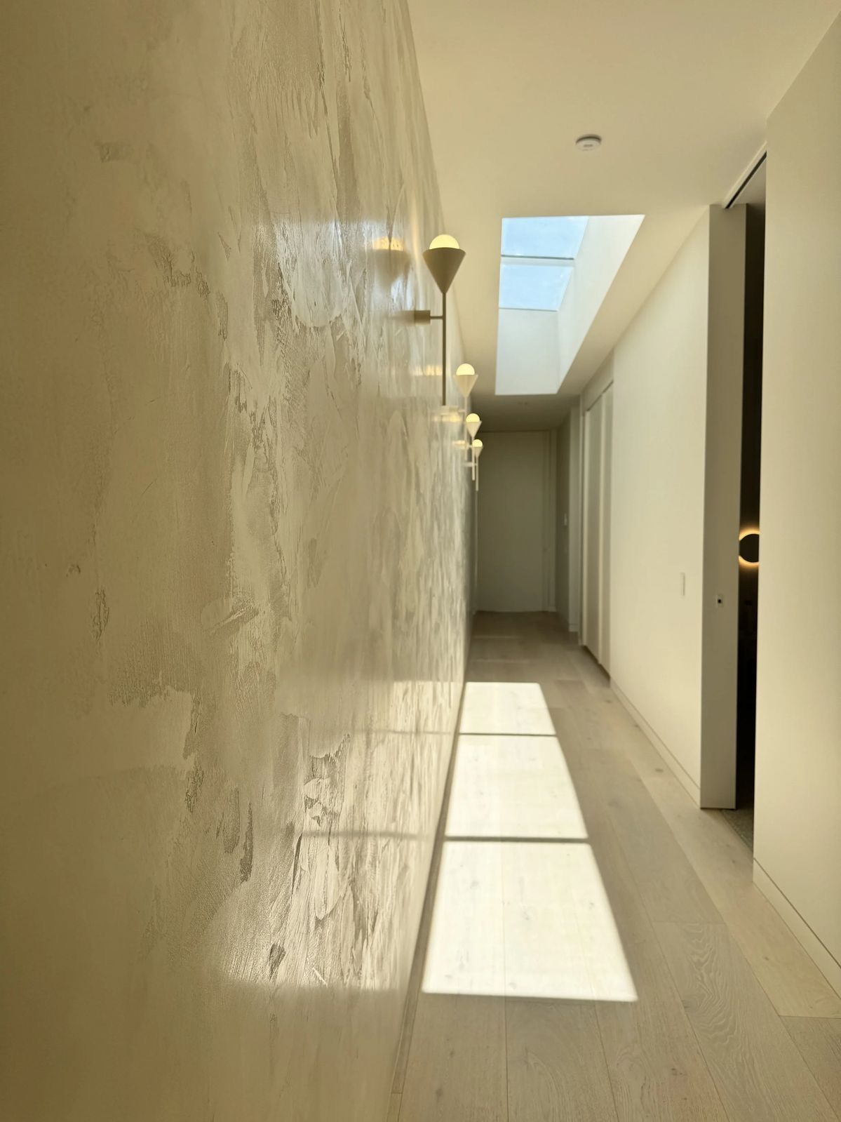 A hand-troweled plaster finish reflecting the craftsmanship behind Koncept Plaster's work.